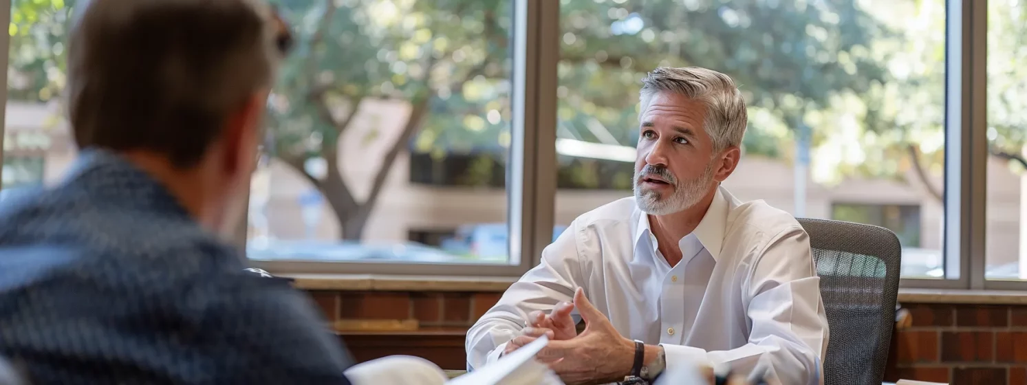 a confident lawyer in a modern office, consulting with a client in austin.